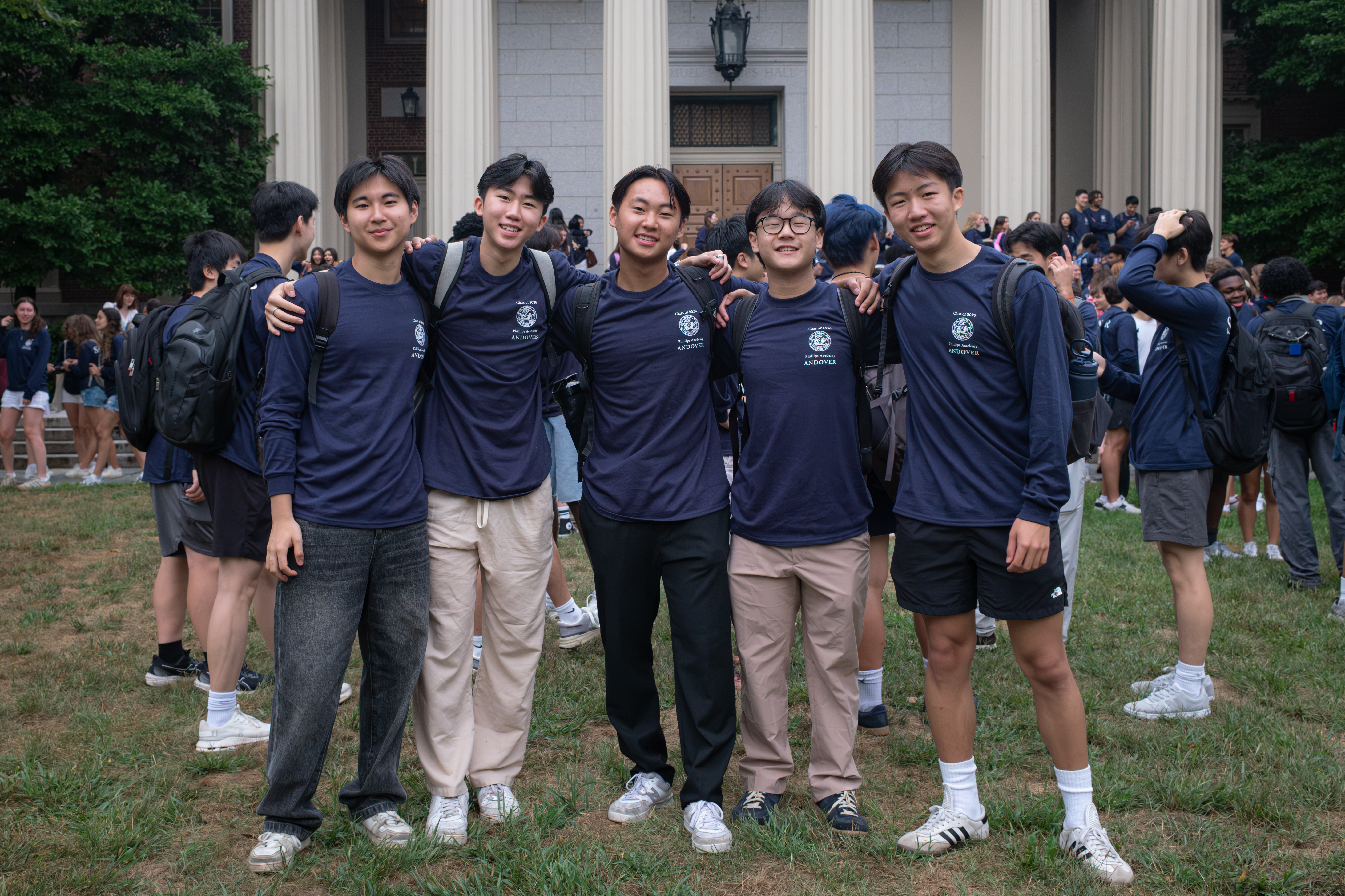 A photo of Philip and 4 friends wearing matching Senior Shirts on the first day of senior year.